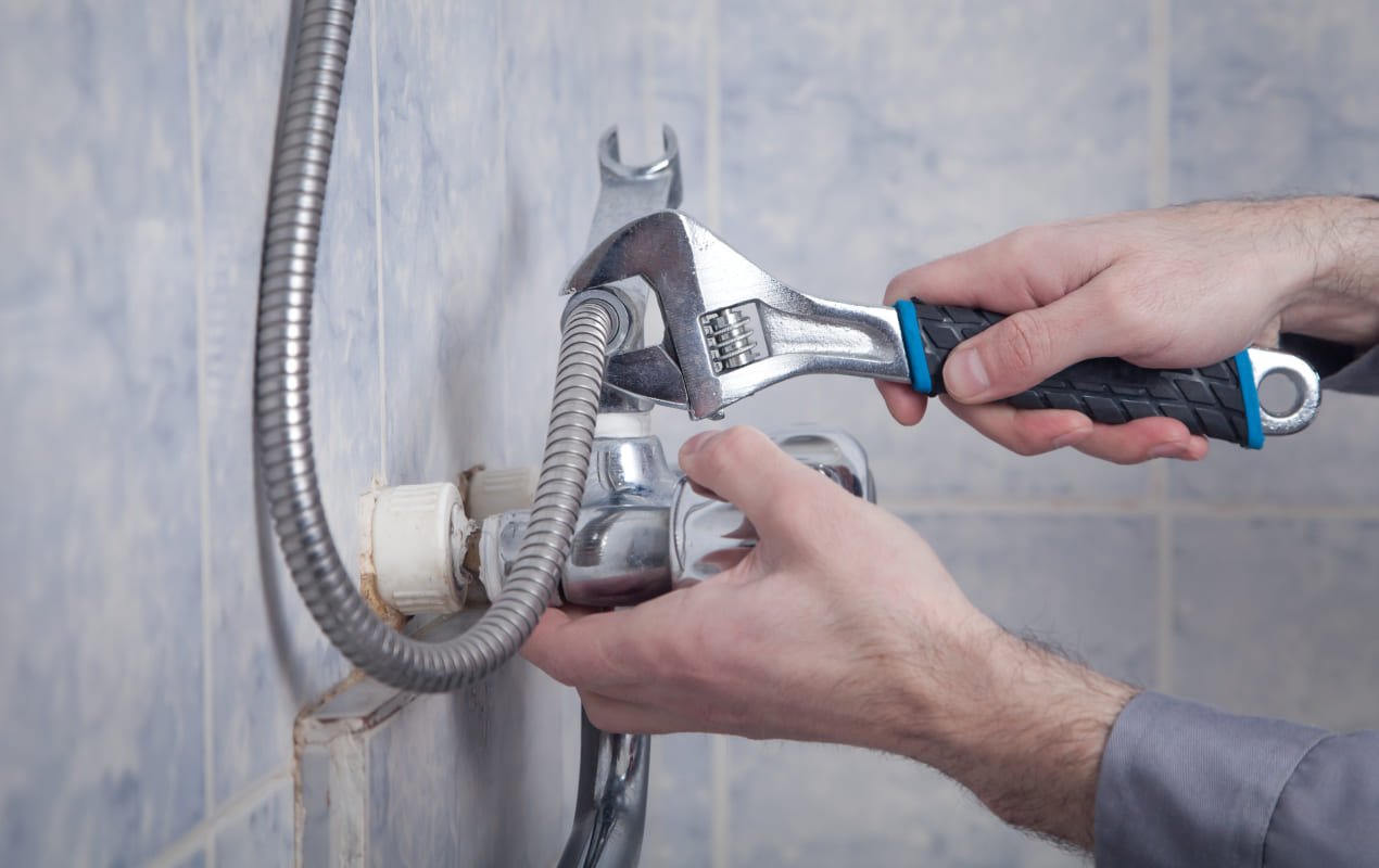 Licensed technician executing professional residential shower valve and fixture repairs