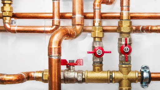Licensed commercial plumber testing gas lines for structural integrity and leaks