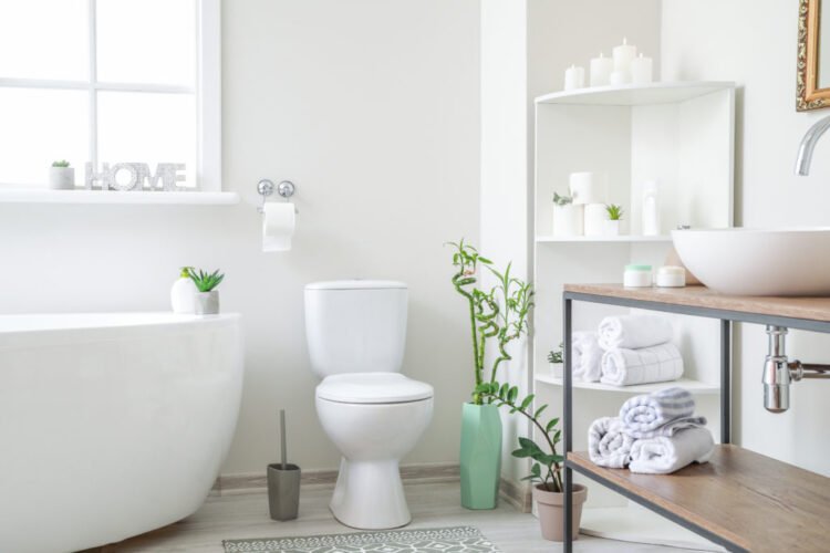 Licensed plumbing technician flawlessly installing a premium new residential toilet